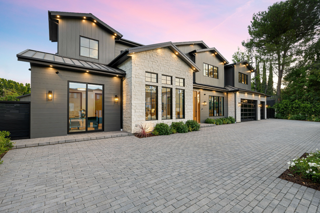 A stunning driveway designed with quality pavers, highlighting expert driveway construction by leading paver contractors from a reputable paving company in Thousand Oaks.