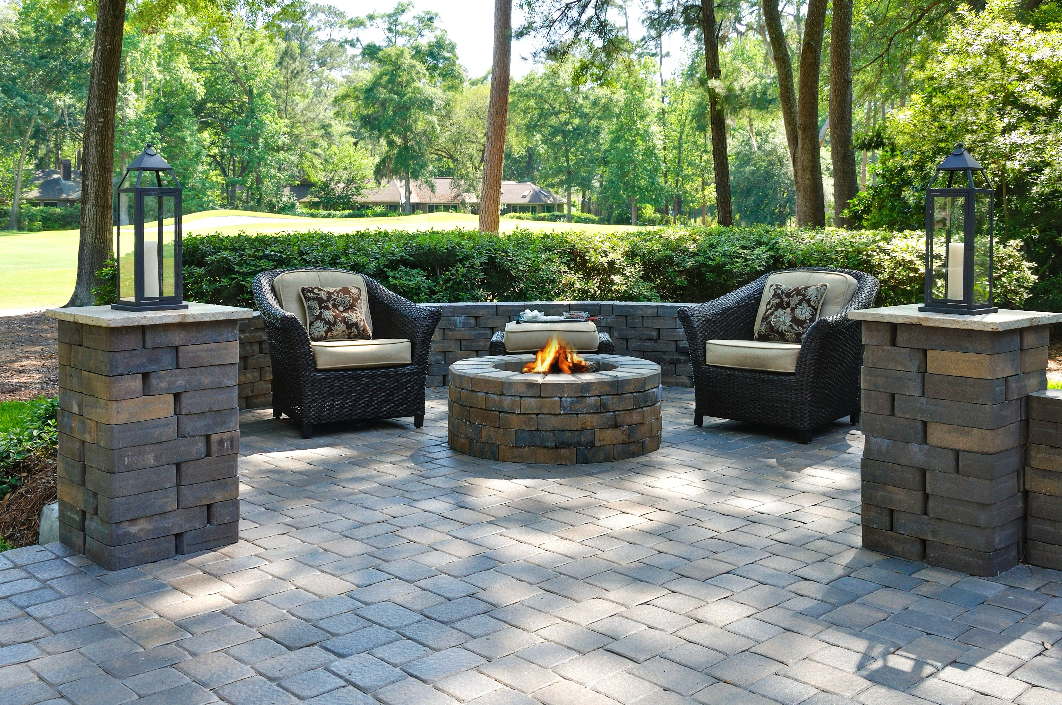 Elegant outdoor patio near a fire pit with expertly installed pavers, highlighting the work of concrete contractors in Los Angeles and general contractors in Beverly Hills, specializing in custom patio installation, paving contractors, paver installation, and patio construction.