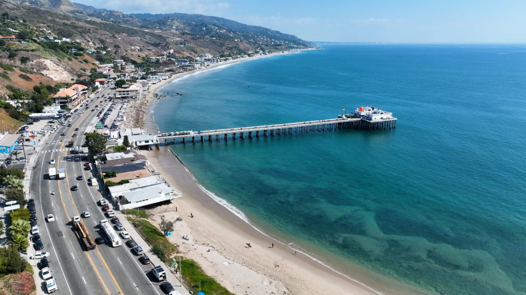 Scenic view of Malibu beachfront, highlighting the expertise of our concrete contractors in Malibu with custom patio installation and driveway construction services.