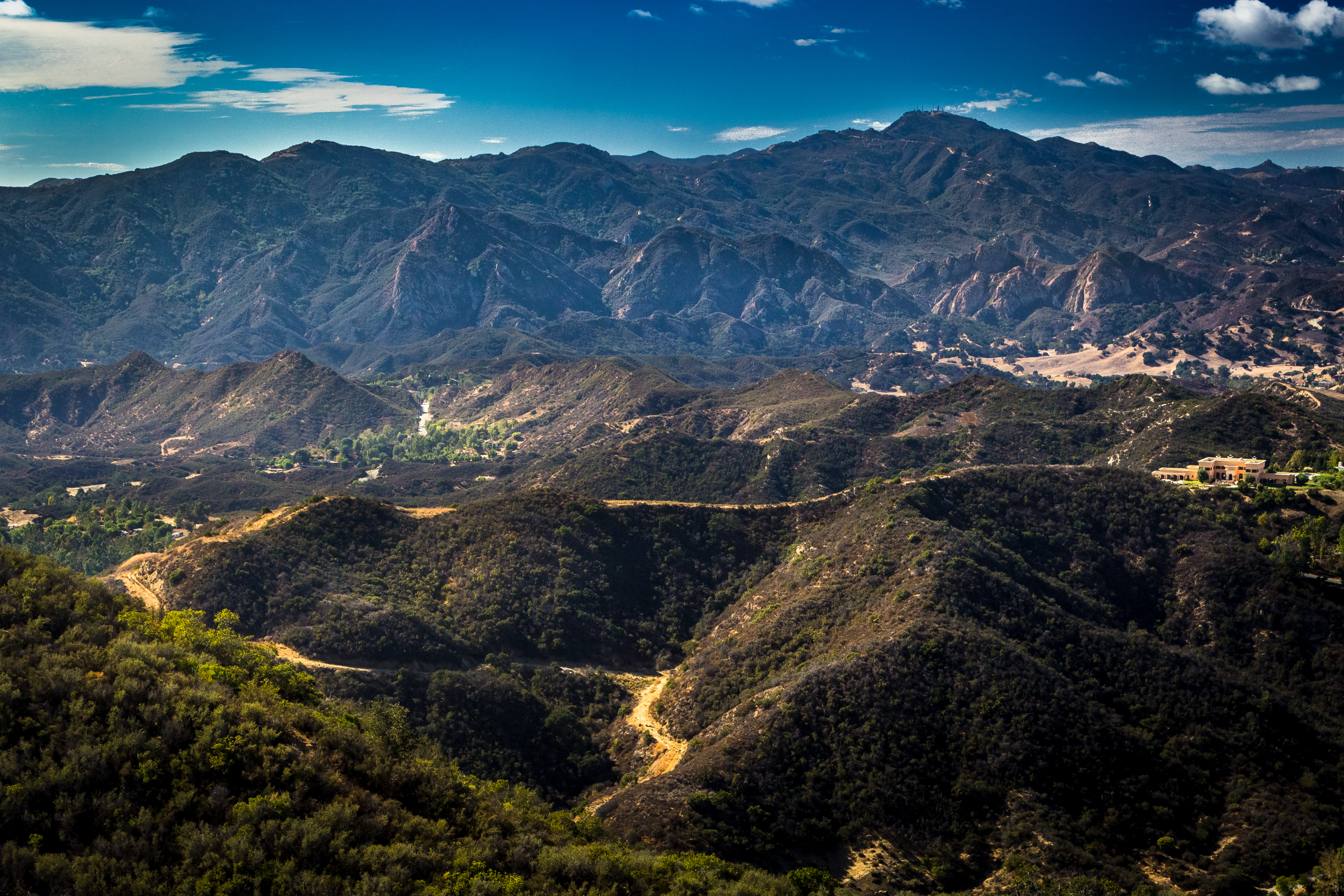 Iconic scenic mountains in Calabasas, symbolizing the craftsmanship of local concrete contractors. Renowned for their custom patio installation in Calabasas, these experts also excel in driveway construction, patio construction, and block wall installation.