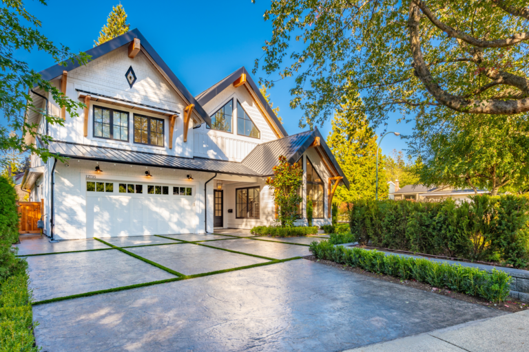 A beautiful home with a re-paved driveway, showcasing the expertise of concrete contractors in Hollywood Hills. Specializing in driveway construction and paved driveway installation, these professionals are also skilled in paver installation, enhancing the curb appeal of homes in the area.