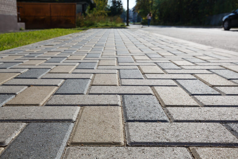 An elegantly constructed paver pathway, showcasing impressive paver patio construction techniques and highlighting elements similar to those used in paver driveway installation.