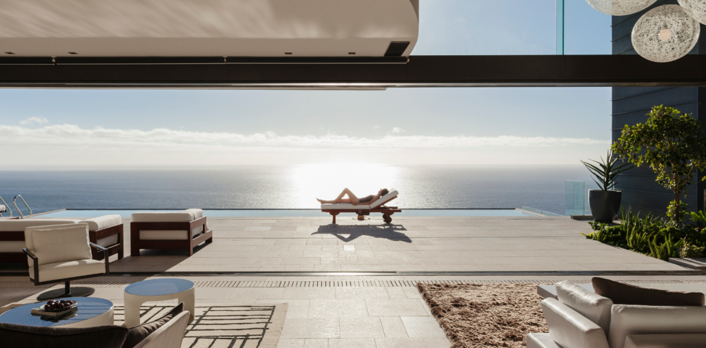 Image showcasing a woman relaxing on a patio.