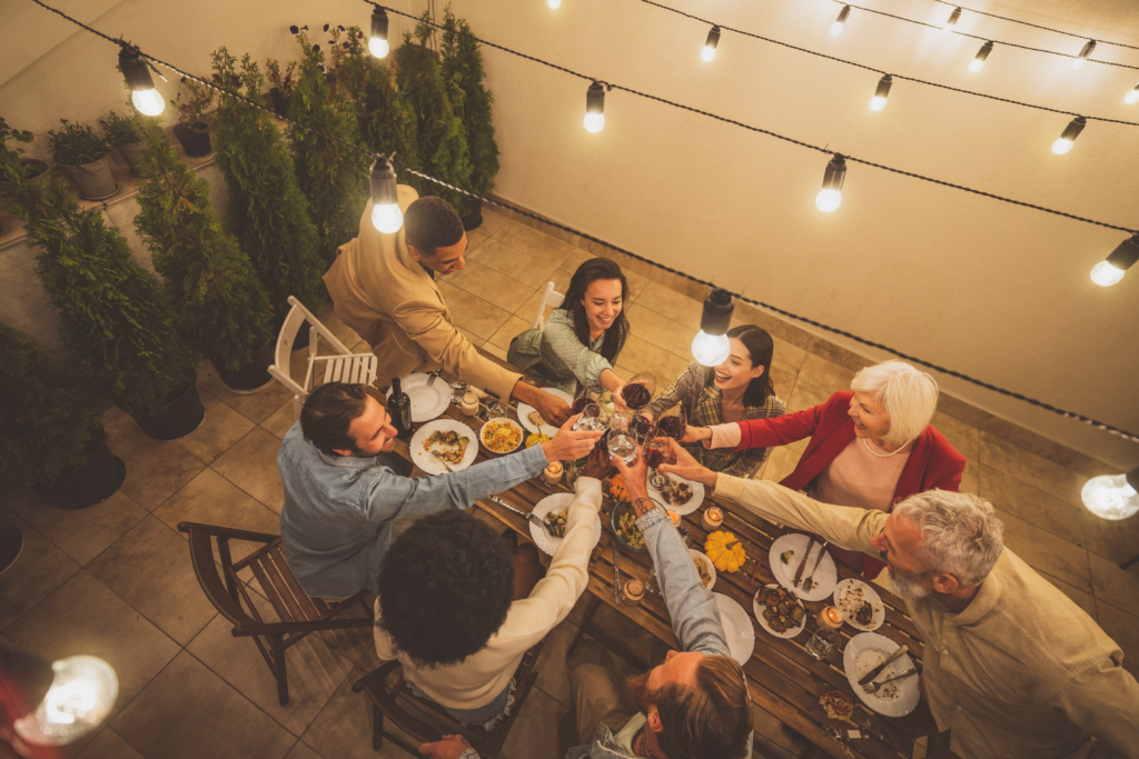 Image showcasing people celebrating on a concrete patio.
