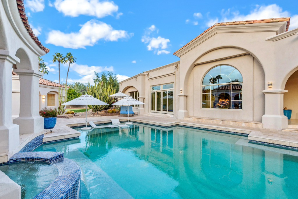 Image showcasing a stunning backyard pool that resembles a resort.