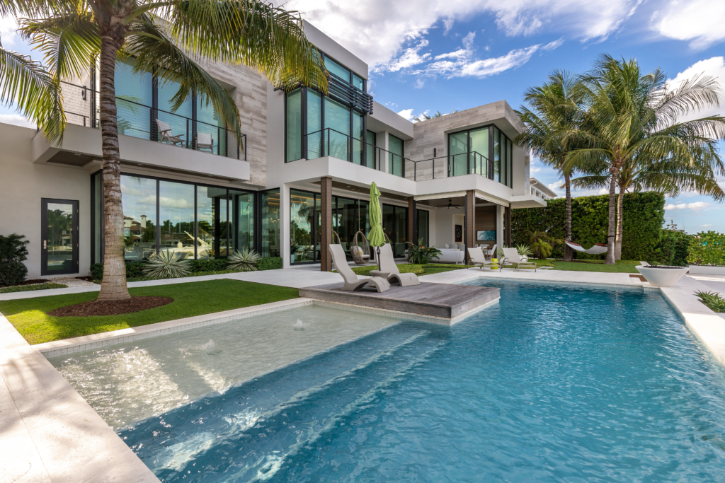 Image showcasing a stunning backyard patio with a luxurious stamped concrete patio and pool.